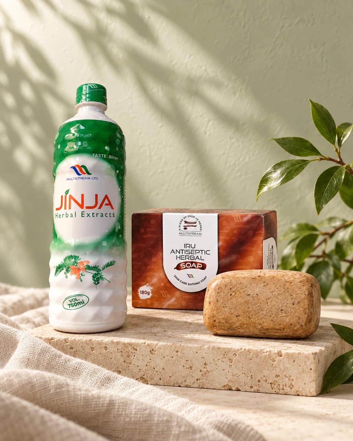 Jinja Herbal Extract and IRU Herbal Soap in a botanical studio composition